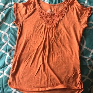 Orange and light green shirts